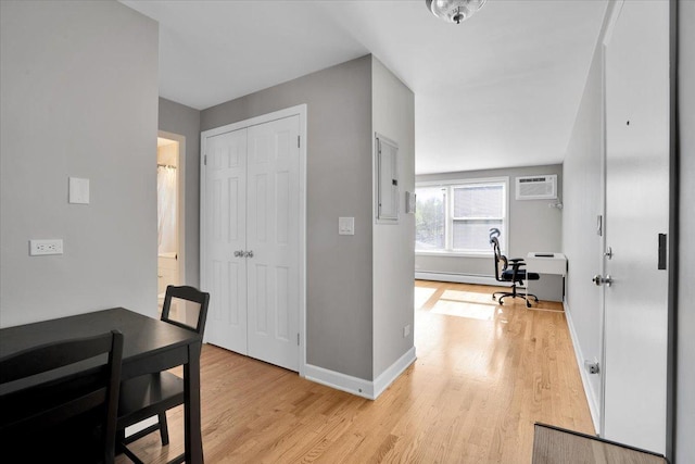 2907 W Summerdale Ave Unit D2, Chicago, IL 60625 - hallway featuring light wood-style floors, an AC wall unit, baseboards, and baseboard heating