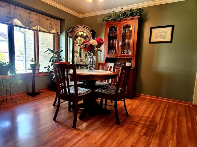 19629 Fiona Ave, Mokena, IL 60448 - dining area with baseboards, crown molding, and light wood finished floors