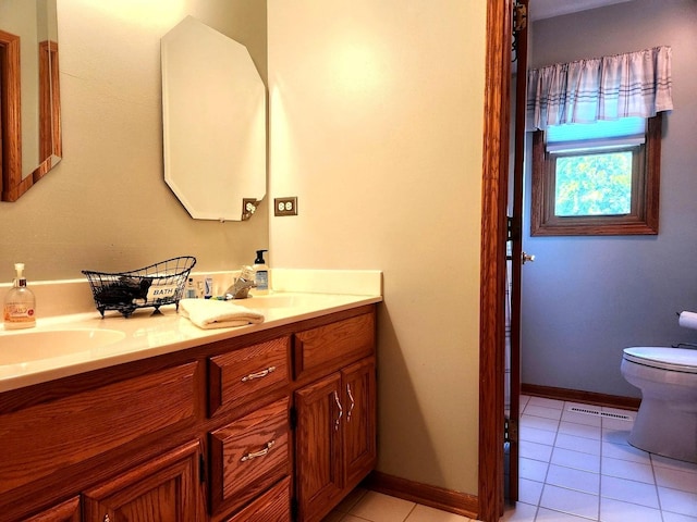 19629 Fiona Ave, Mokena, IL 60448 - bathroom featuring double vanity, toilet, tile patterned flooring, and baseboards