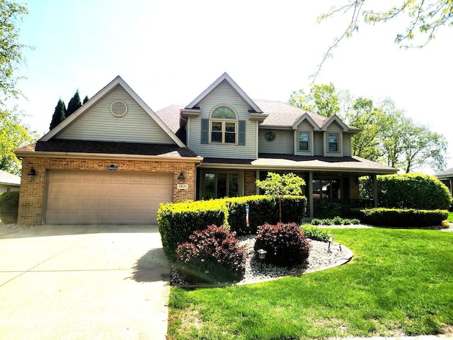 19629 Fiona Ave, Mokena, IL 60448 - view of front of property with a garage, brick siding, a front lawn, and concrete driveway