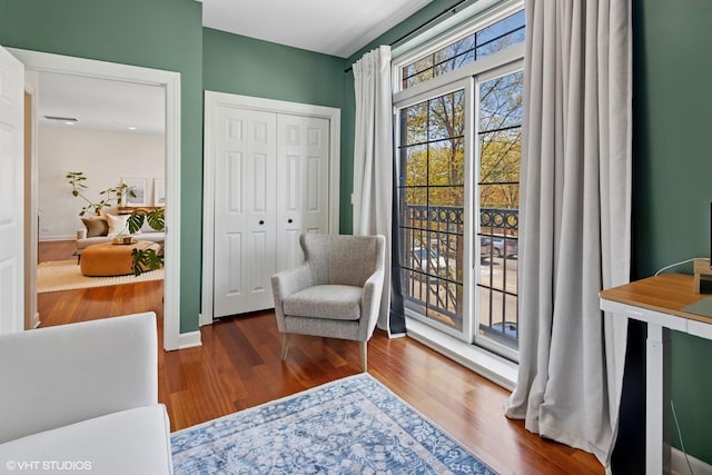 sitting room featuring wood finished floors and baseboards