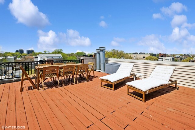 wooden deck featuring outdoor dining space