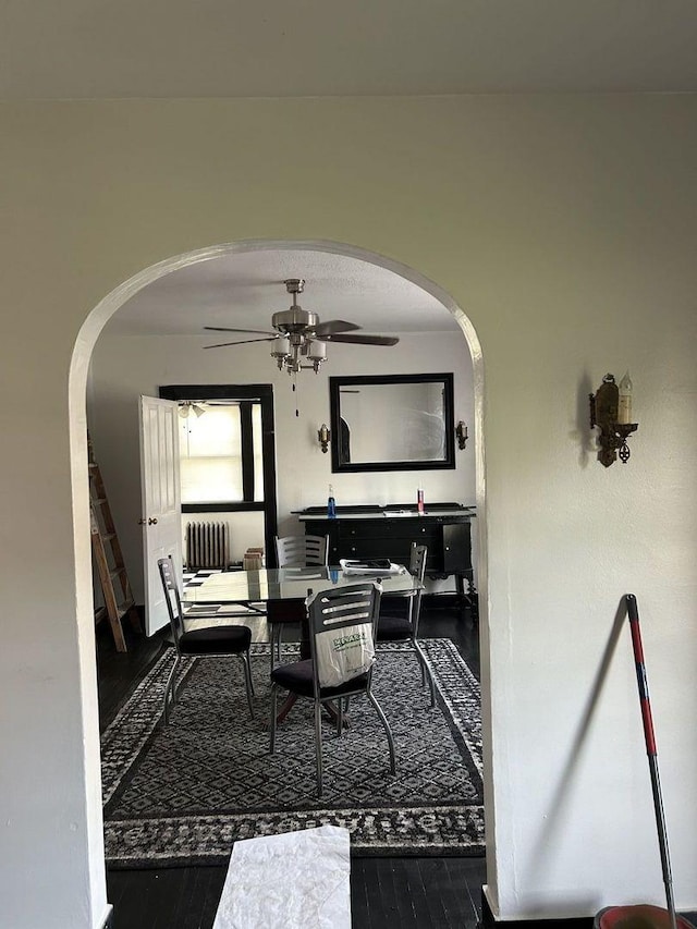 720 S Carroll Ave, Freeport, IL 61032 - dining room with arched walkways, wood finished floors, and ceiling fan