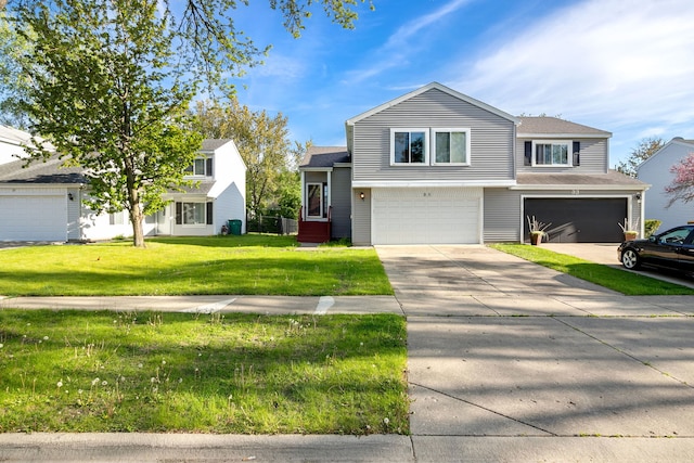 35 Buckingham Ln, Buffalo Grove, IL 60089 - view of front of property with an attached garage, a front yard, a shingled roof, and concrete driveway