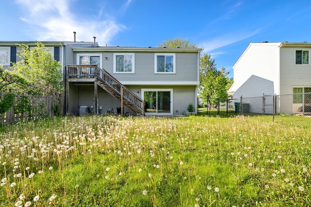 35 Buckingham Ln, Buffalo Grove, IL 60089 - rear view of house with stairway, fence, a deck, and central air condition unit