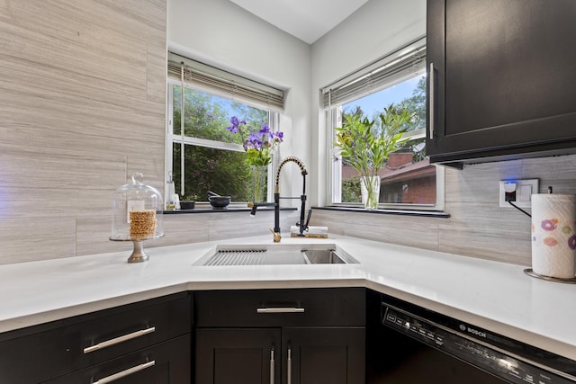 428 S Hillside Ave, Elmhurst, IL 60126 - kitchen featuring dishwasher, a sink, decorative backsplash, and light countertops