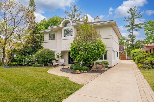 428 S Hillside Ave, Elmhurst, IL 60126 - view of front of property with stucco siding and a chimney
