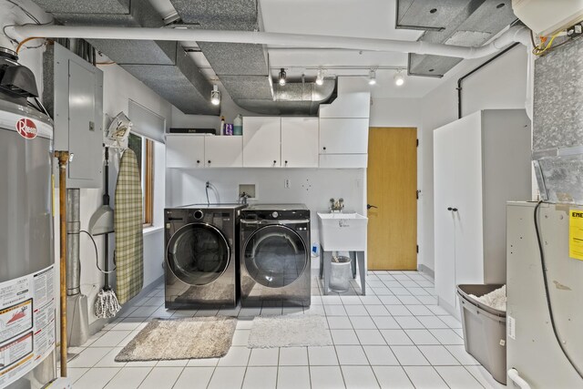 428 S Hillside Ave, Elmhurst, IL 60126 - washroom with cabinet space, washer and dryer, electric panel, gas water heater, and light tile patterned floors
