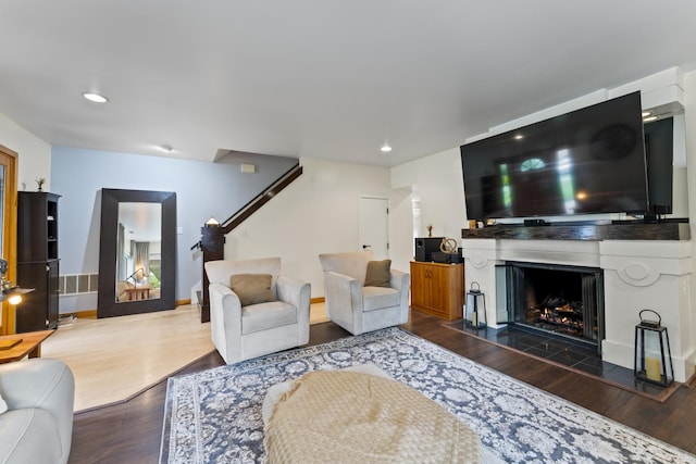 428 S Hillside Ave, Elmhurst, IL 60126 - living room featuring wood finished floors, a lit fireplace, recessed lighting, baseboards, and stairs