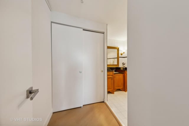 hallway with light wood-style floors