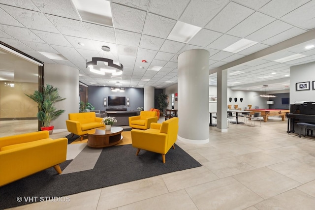 building lobby featuring a paneled ceiling