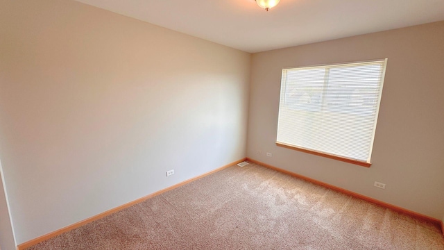 6409 Old Plank Blvd, Matteson, IL 60443 - empty room with light carpet and baseboards