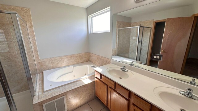 6409 Old Plank Blvd, Matteson, IL 60443 - bathroom featuring a shower stall, a tub with jets, double vanity, and tile patterned floors
