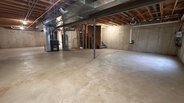 6409 Old Plank Blvd, Matteson, IL 60443 - unfinished below grade area with water heater, heating unit, and stairs