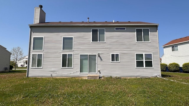 6409 Old Plank Blvd, Matteson, IL 60443 - back of property with a yard and a chimney