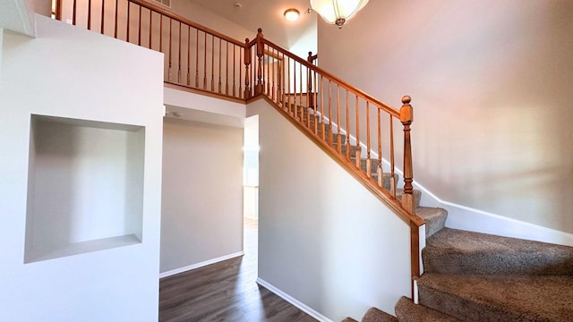 6409 Old Plank Blvd, Matteson, IL 60443 - staircase featuring wood finished floors, baseboards, and a towering ceiling