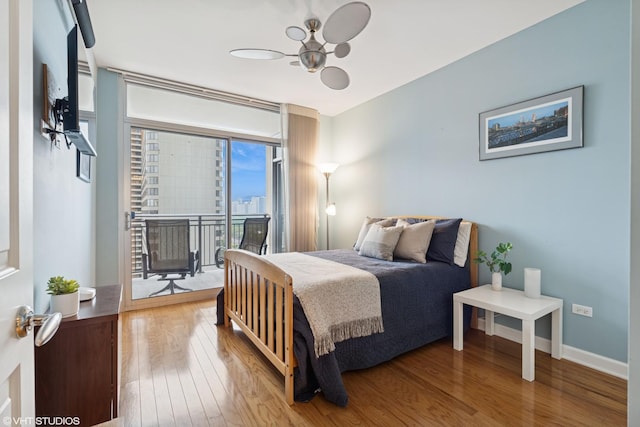 1250 S Michigan Ave Unit 2203, Chicago, IL 60605 - bedroom featuring access to outside, wood finished floors, and baseboards