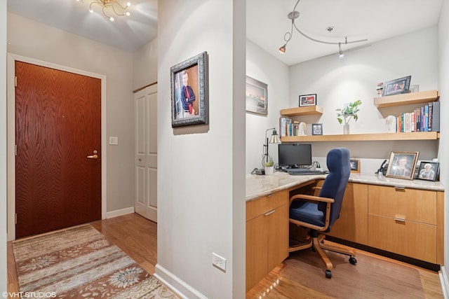 1250 S Michigan Ave Unit 2203, Chicago, IL 60605 - office space featuring built in desk, light wood-type flooring, and baseboards