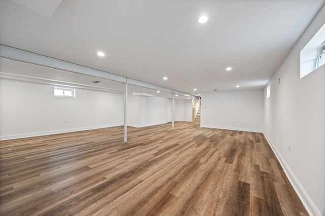 below grade area featuring wood finished floors, recessed lighting, and baseboards