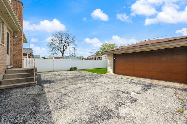 garage featuring fence