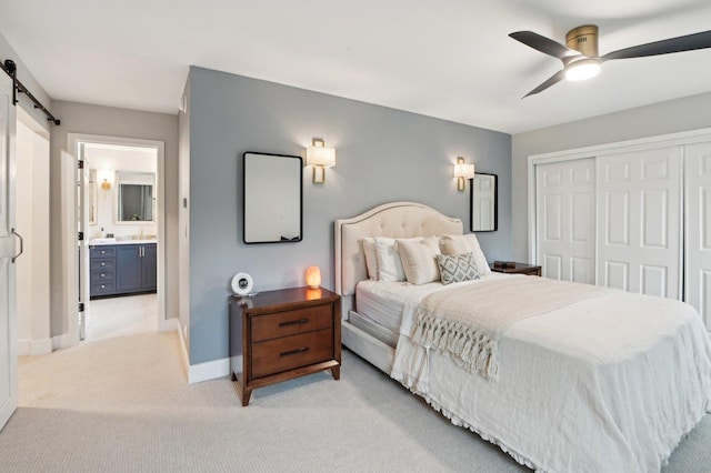 0N467 Cloos Ct, Winfield, IL 60190 - bedroom with a barn door, light colored carpet, a closet, baseboards, and ceiling fan