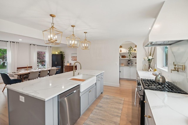 0N467 Cloos Ct, Winfield, IL 60190 - kitchen featuring appliances with stainless steel finishes, premium range hood, a sink, gray cabinetry, and light stone countertops