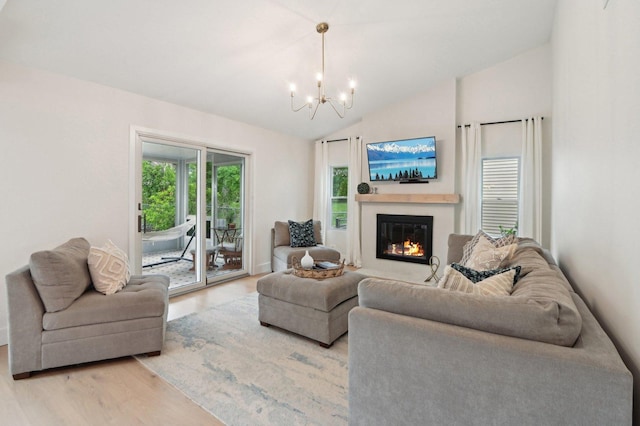 0N467 Cloos Ct, Winfield, IL 60190 - living room with a chandelier, light wood-type flooring, a glass covered fireplace, and vaulted ceiling