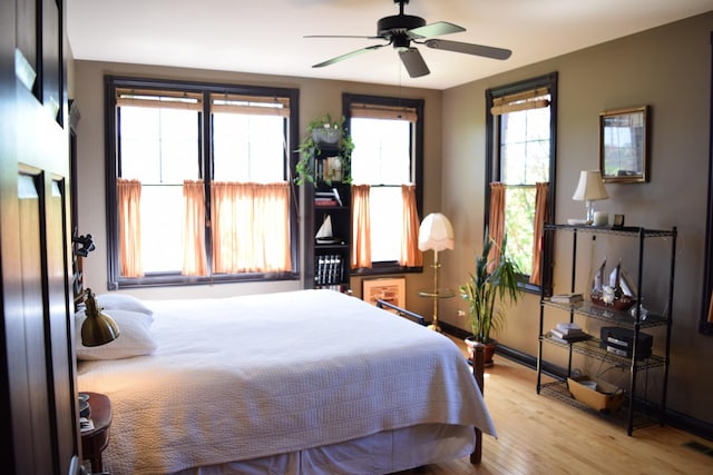 133 S Grove Ave, Elgin, IL 60120 - bedroom with wood finished floors, baseboards, and a ceiling fan