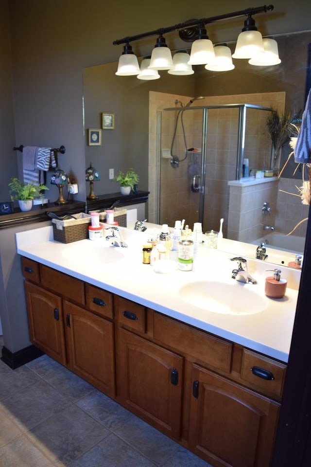 133 S Grove Ave, Elgin, IL 60120 - full bath featuring a shower stall, double vanity, and tile patterned flooring