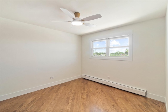 2334 N Harlem Ave Unit 3C, Elmwood Park, IL 60707 - spare room with a baseboard heating unit, baseboards, and light wood finished floors