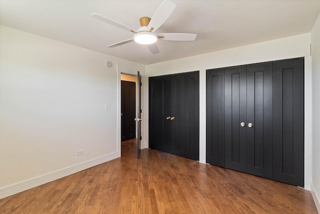 2334 N Harlem Ave Unit 3C, Elmwood Park, IL 60707 - unfurnished bedroom featuring wood finished floors, baseboards, multiple closets, and a ceiling fan