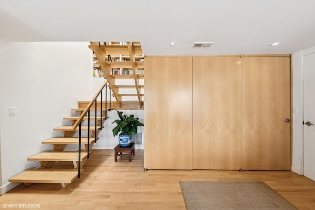 58 W Schiller St, Chicago, IL 60610 - stairway featuring wood finished floors and recessed lighting