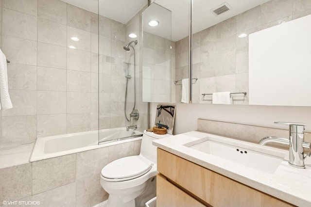 58 W Schiller St, Chicago, IL 60610 - full bath featuring tiled shower / bath, toilet, vanity, and tile walls