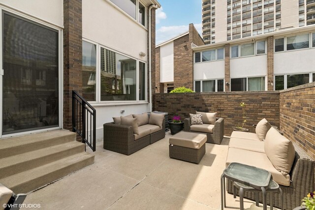 58 W Schiller St, Chicago, IL 60610 - view of patio / terrace featuring an outdoor living space, fence, and entry steps