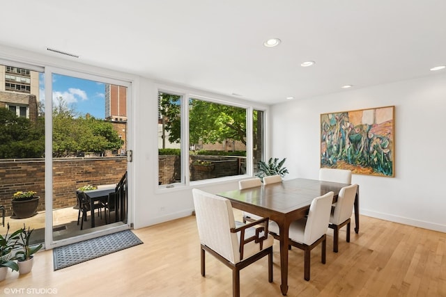 58 W Schiller St, Chicago, IL 60610 - dining space featuring light wood-style floors, recessed lighting, and baseboards