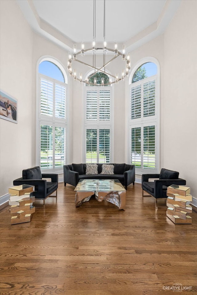 6590 Beech Ln, Libertyville, IL 60048 - living room featuring a towering ceiling, plenty of natural light, a chandelier, and wood finished floors
