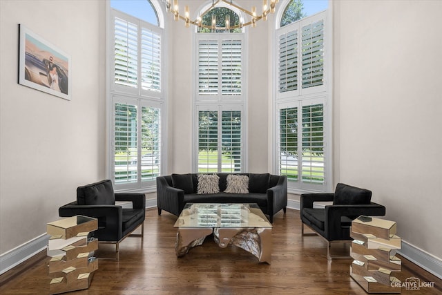 6590 Beech Ln, Libertyville, IL 60048 - living room featuring a chandelier, plenty of natural light, wood finished floors, and a high ceiling