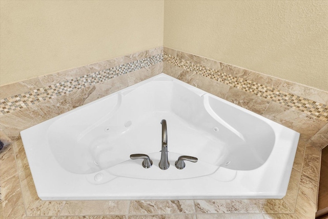 1601 Congressional Way, Champaign, IL 61822 - bathroom view of a tub with jets and a textured wall