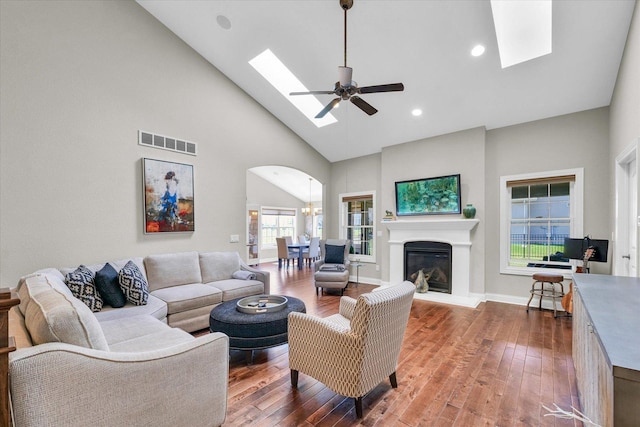 1601 Congressional Way, Champaign, IL 61822 - living room with a skylight, high vaulted ceiling, wood finished floors, a ceiling fan, and arched walkways