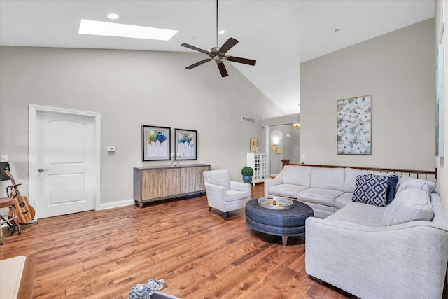 1601 Congressional Way, Champaign, IL 61822 - living room with high vaulted ceiling, light wood finished floors, a ceiling fan, a skylight, and baseboards