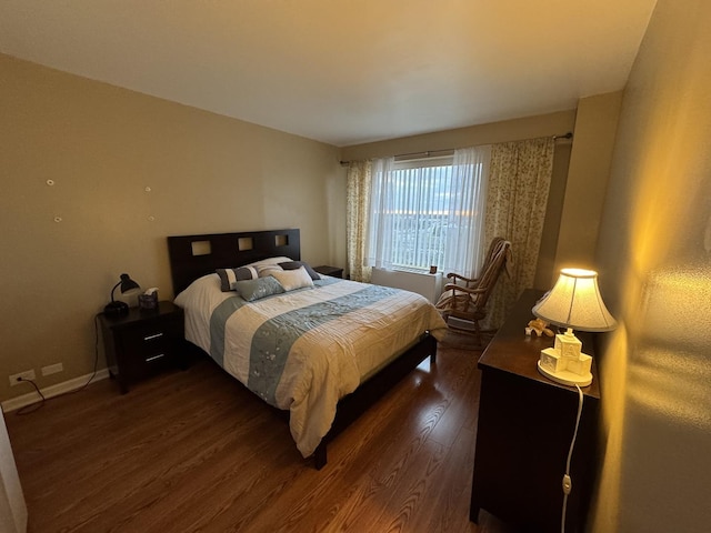 7033 N Kedzie Ave Unit 904, Chicago, IL 60645 - bedroom featuring dark wood finished floors and baseboards