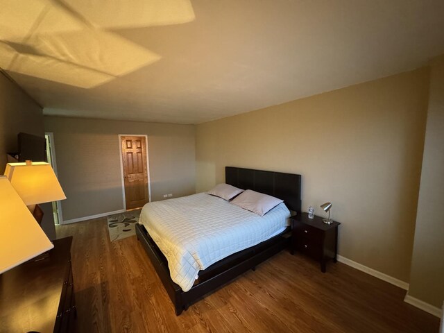 7033 N Kedzie Ave Unit 904, Chicago, IL 60645 - bedroom with dark wood-type flooring and baseboards