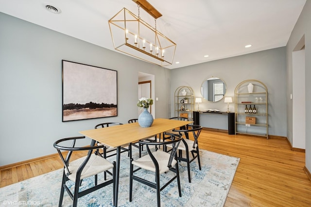 5055 N Sheridan Rd Unit 3N, Chicago, IL 60640 - dining area with light wood-type flooring, a chandelier, and recessed lighting