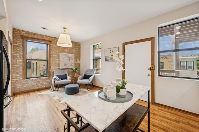 5055 N Sheridan Rd Unit 3N, Chicago, IL 60640 - living area with brick wall and light wood finished floors