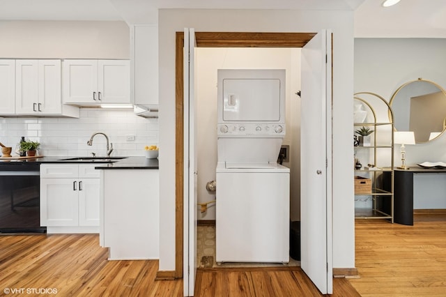 5055 N Sheridan Rd Unit 3N, Chicago, IL 60640 - laundry room featuring stacked washer / dryer, light wood-type flooring, and recessed lighting