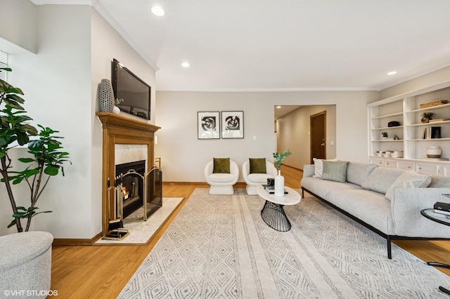 5055 N Sheridan Rd Unit 3N, Chicago, IL 60640 - living room with crown molding, light wood-style flooring, a fireplace, and recessed lighting