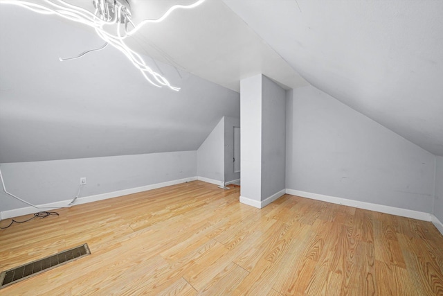 5512 W Wrightwood Ave, Chicago, IL 60639 - additional living space featuring lofted ceiling and wood finished floors