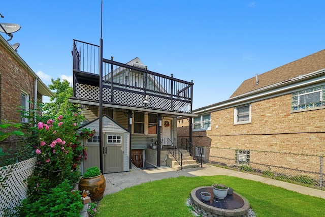 5512 W Wrightwood Ave, Chicago, IL 60639 - back of house featuring a yard and a balcony