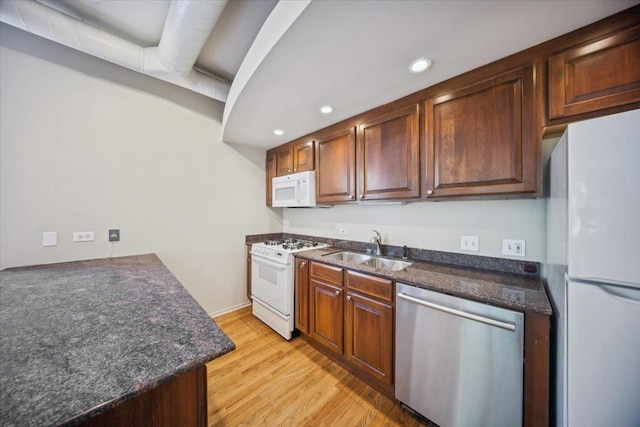 811 S Lytle St Unit 101, Chicago, IL 60607 - kitchen featuring white appliances, a sink, light wood-type flooring, and recessed lighting