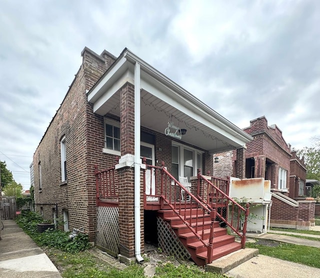 2439 S 57th Ave, Cicero, IL 60804 - view of front facade with brick siding and a porch